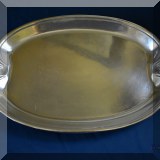 S16. Metal platter with shell shaped handles. 21” x 13” - $32